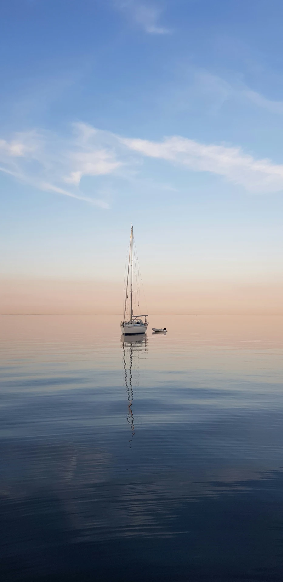White sailboat on a calm ocean